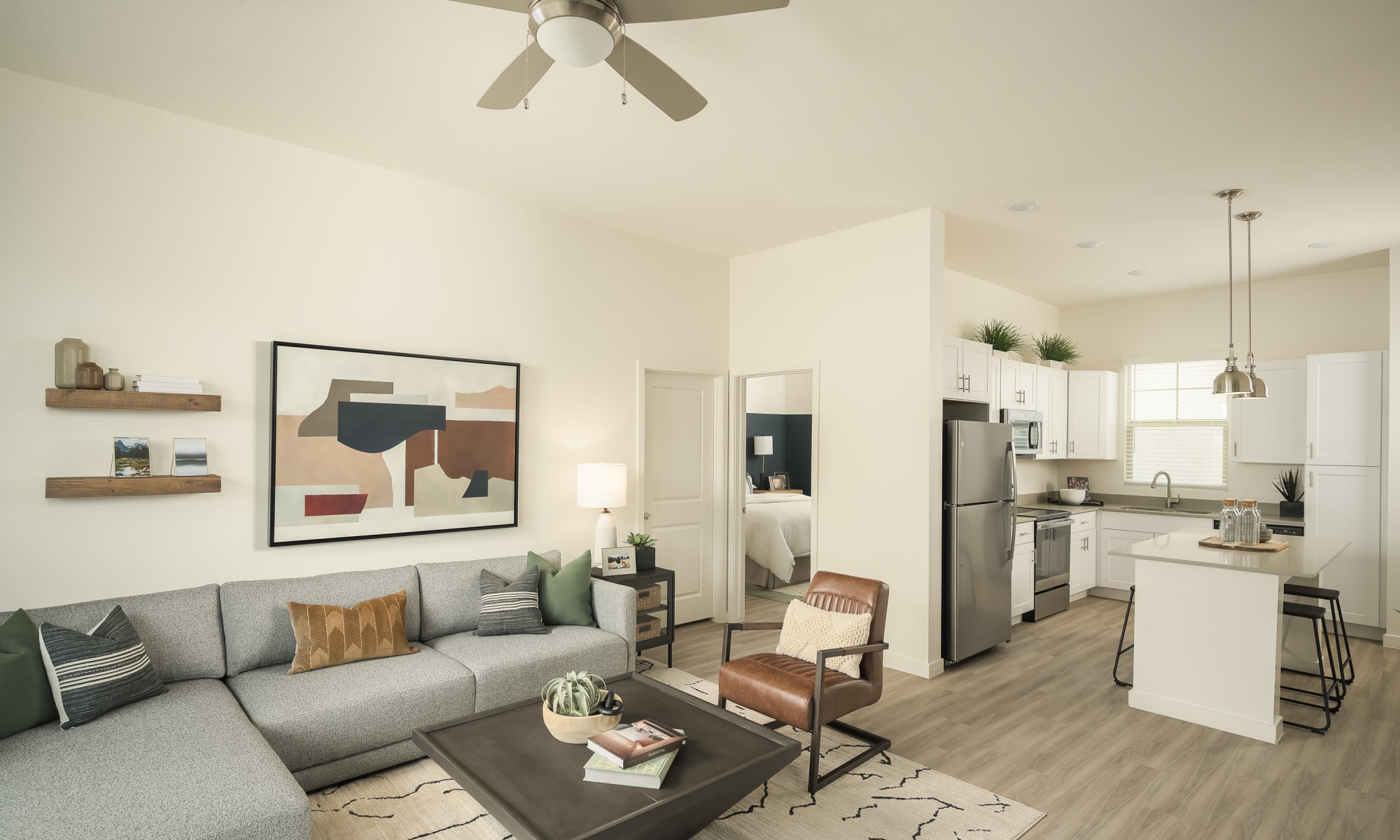 Living room looking into kitchen at Estia Windrose in Litchfield Park, Arizona