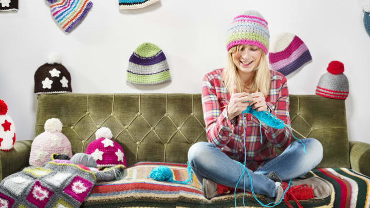Women at home knitting at Olympus on Main in Carrollton, Texas