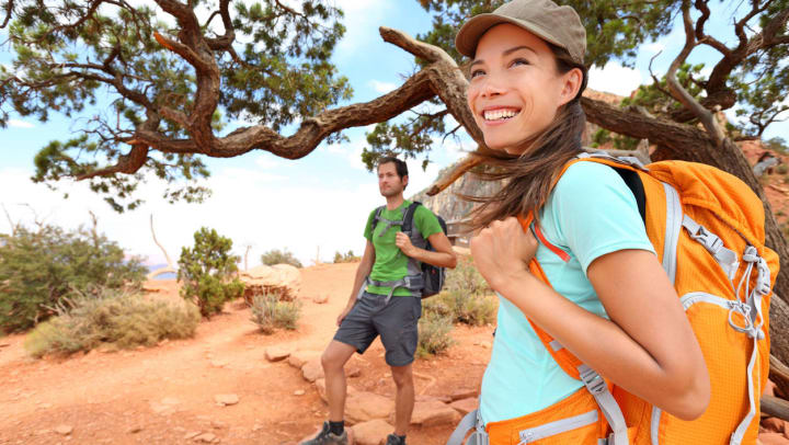 A man and woman hiking on a trail in Arizona | Camelback Mountain