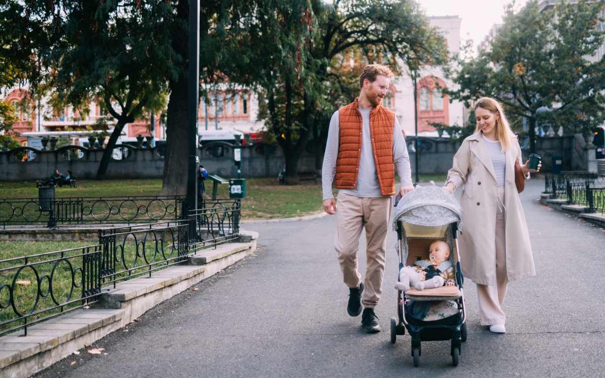 Residents walking with his son in a nearby park at Historic Boylan Apartments in Raleigh, North Carolina