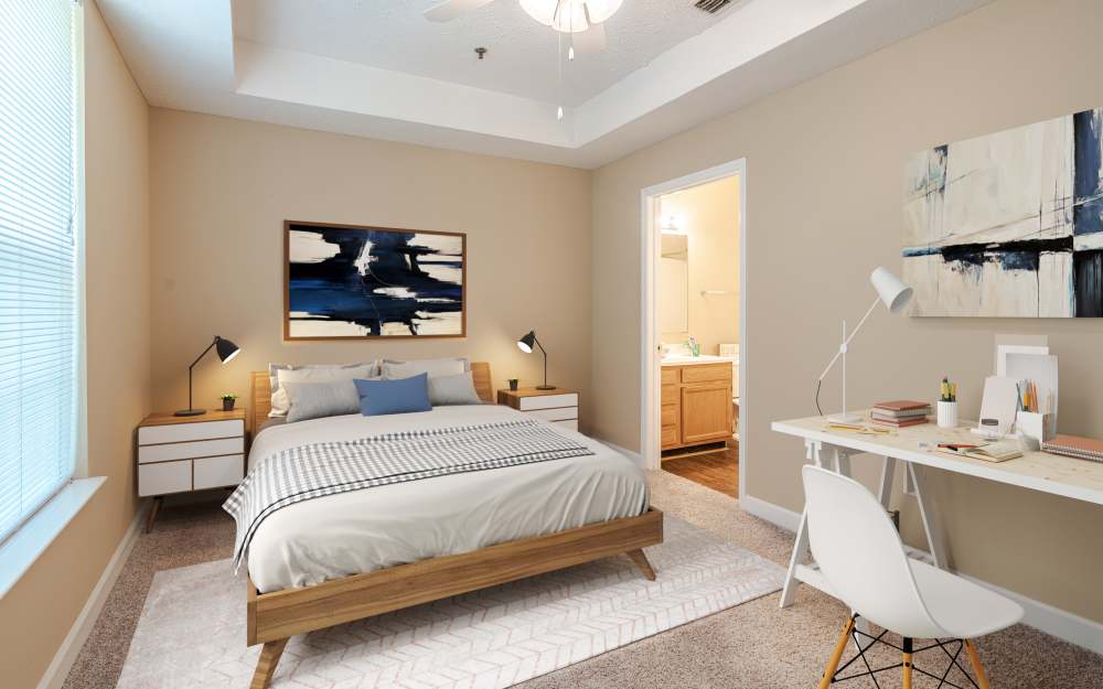 Model bedroom with ensuite bathroom and walk-in closet at Main Street Apartments in Huntsville, Alabama