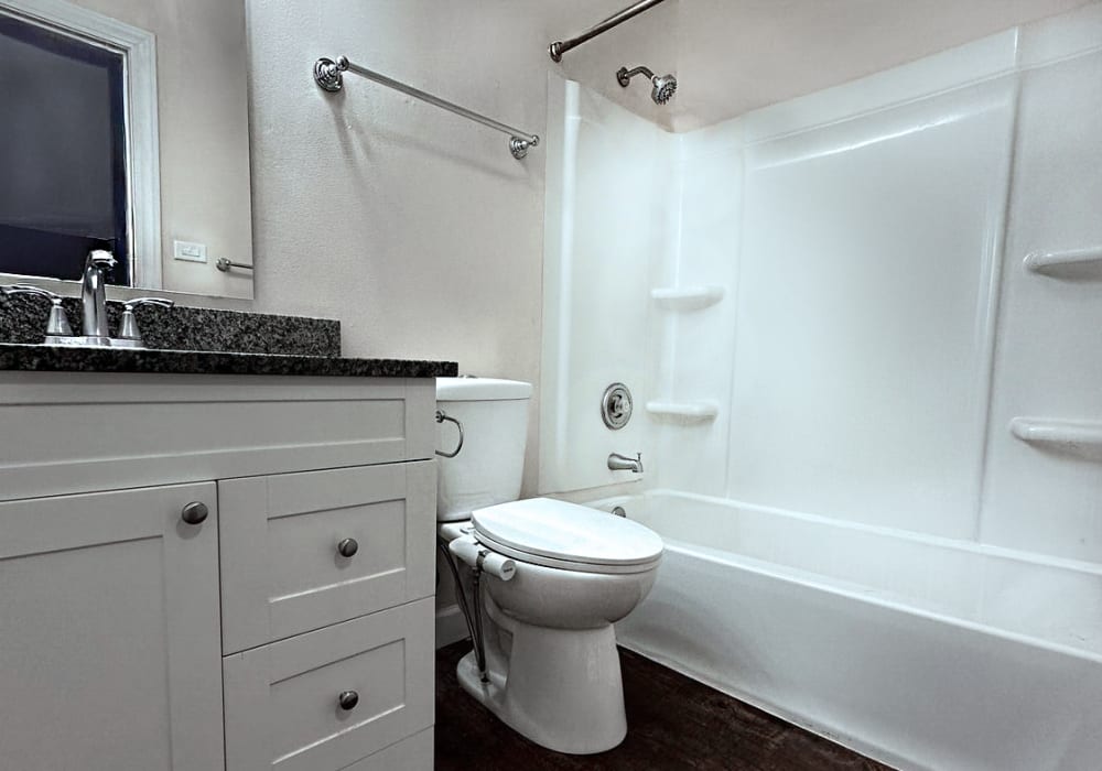 Bathroom with bath-tub at Main Street Apartments in Bensenville, Illinois