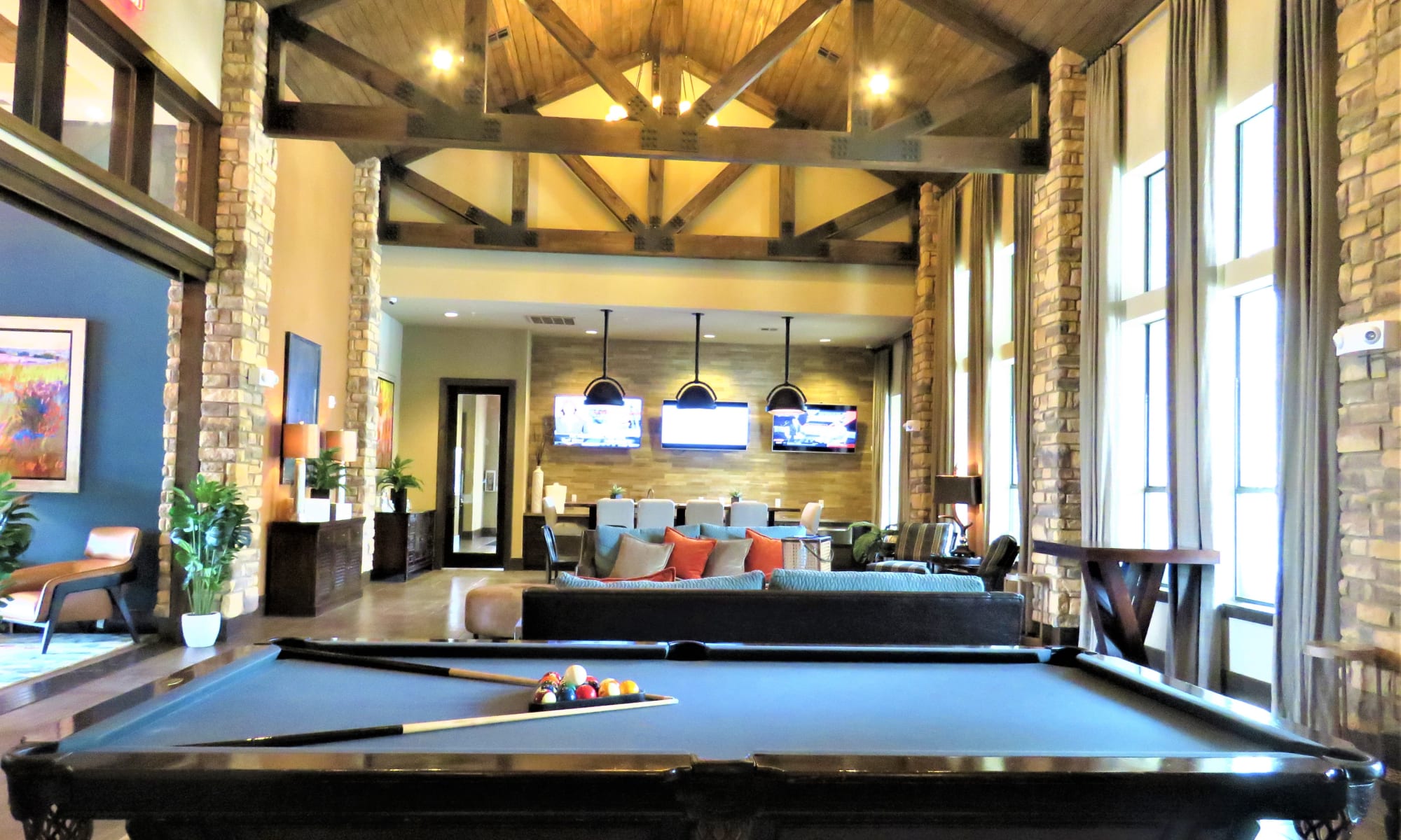 Plenty of comfortable seating in The Abbey at Spring Town Center clubhouse for viewing the big game on the widescreen tv