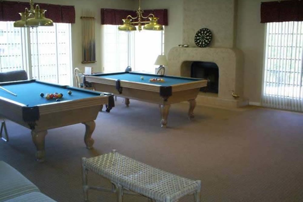 Game room complete with pool tables at The Grand Court Senior Living in Mesa, Arizona