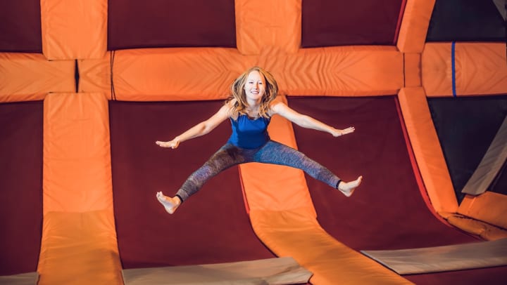Woman jumping in the air at a trampoline park | trampoline parks in Chandler