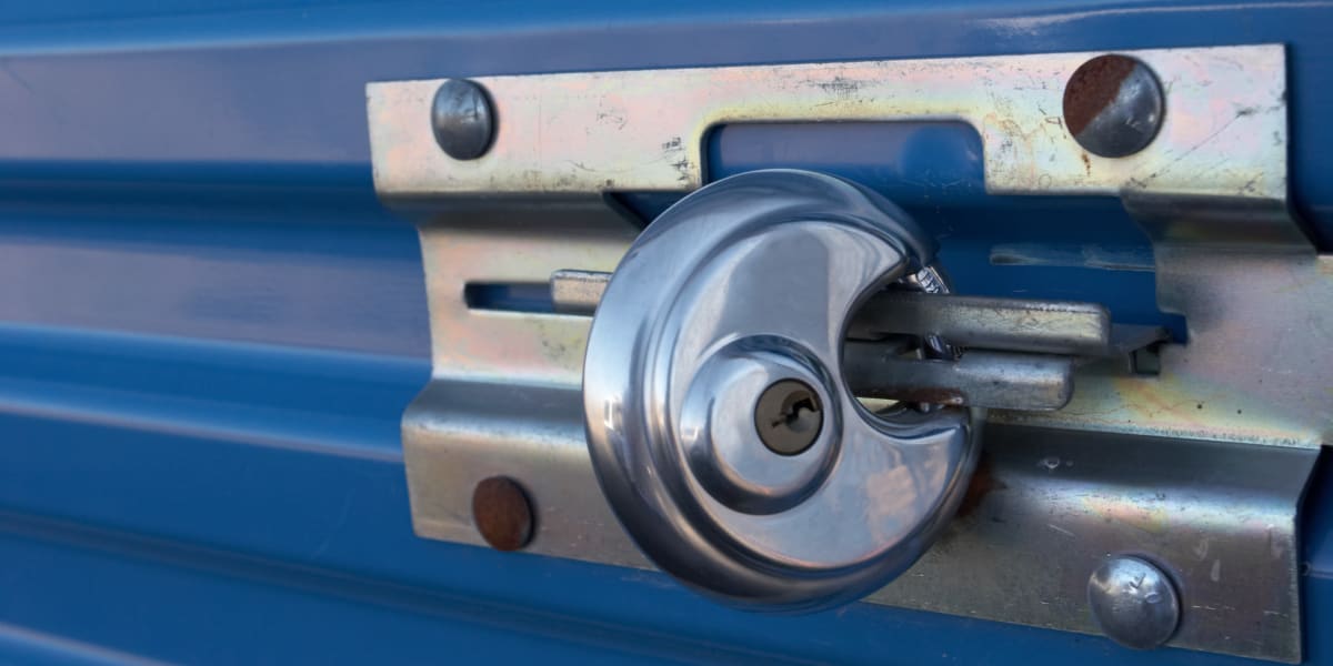 Blue storage unit with a lock on it at Neighborhood Self Storage