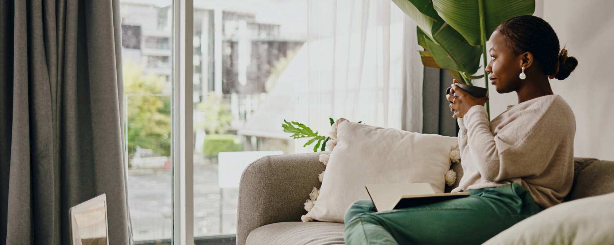 Resident resting in the living room at St. Simon's Terrace in Rochester, New York