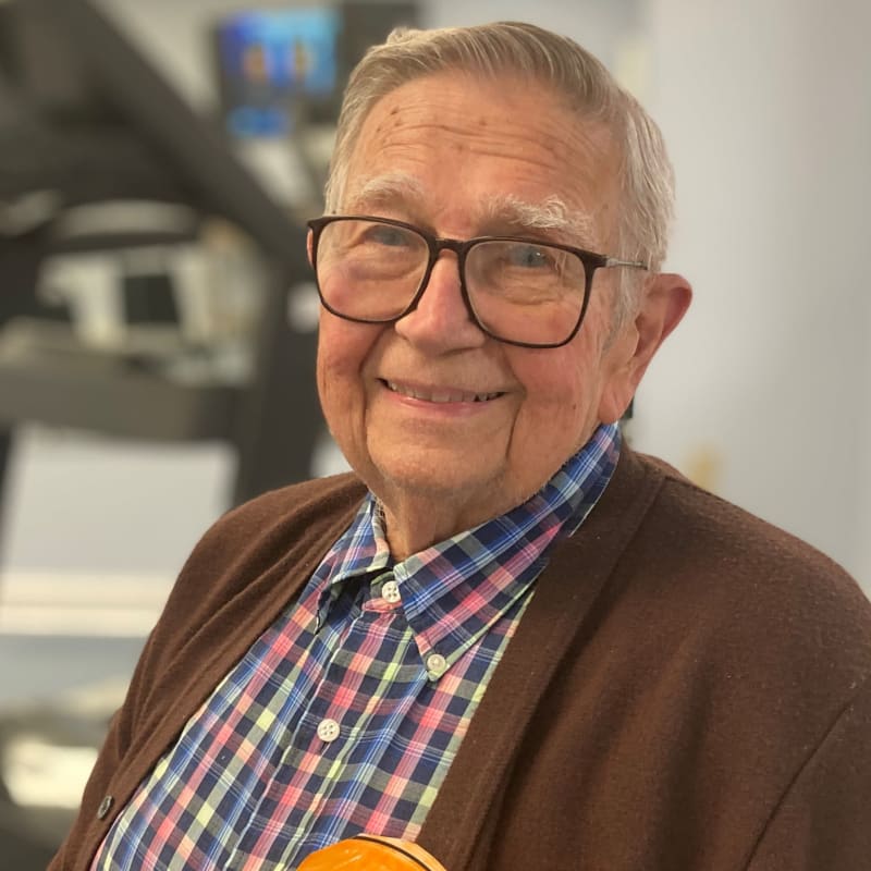 Smiling resident in a two piece suit at The Clinton Presbyterian Community in Clinton, South Carolina