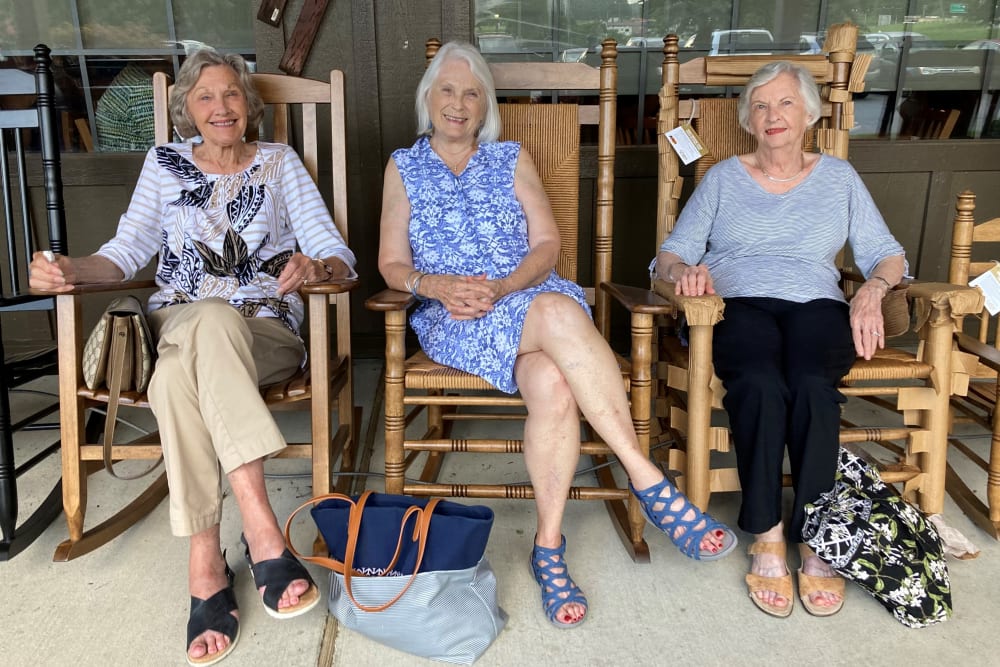 3 Residents sitting on the porch at The Clinton Presbyterian Community in Clinton, South Carolina