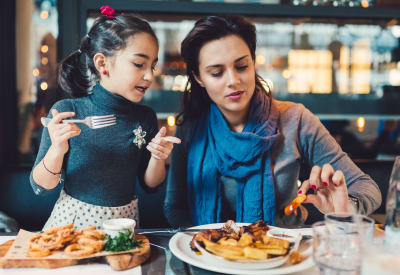 Mom and daughter having dinner near Westport Apartments in Angleton, Texas