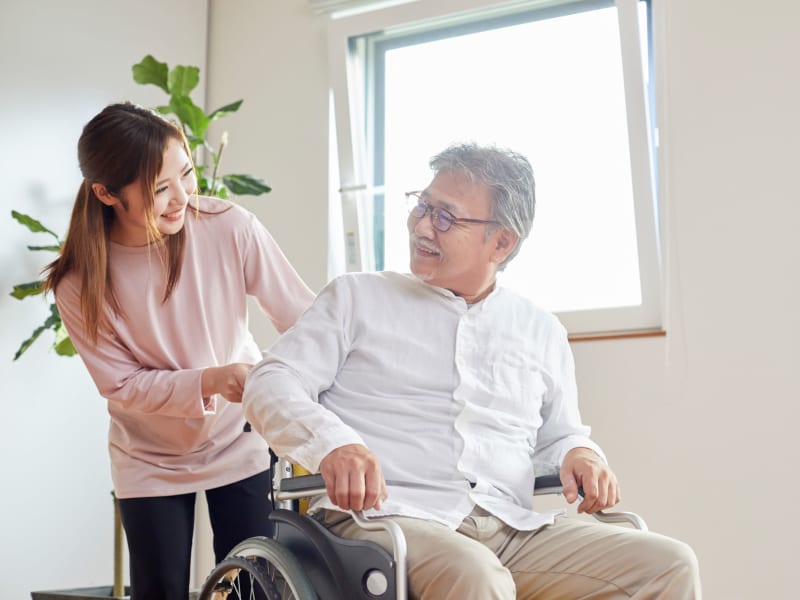 Resident getting a visit from his daughter at Transitions At Home - Central in Stevens Point, Wisconsin