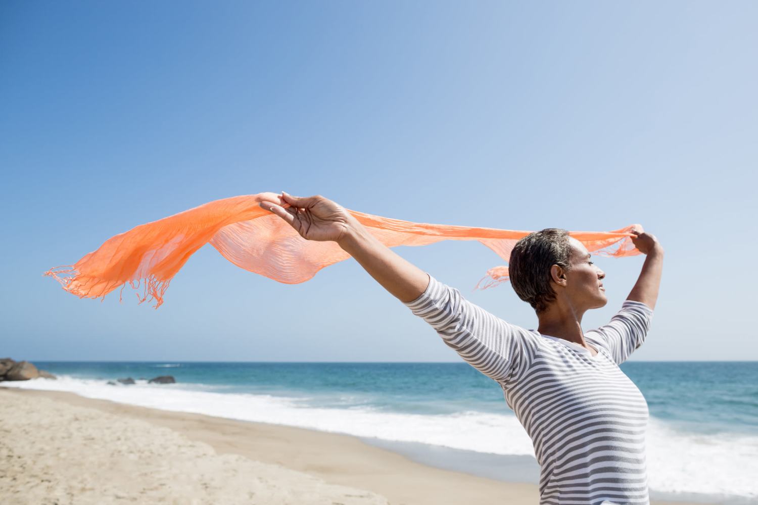 Woman with a scarf in the wind at the beach at Corp Site Testing in Bend, Oregon