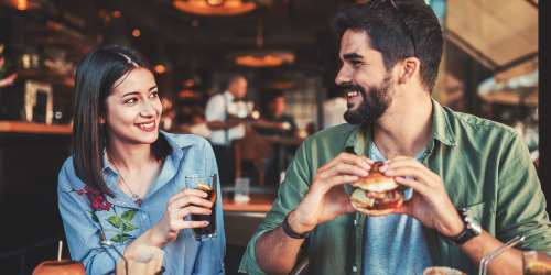 A couple having food in a restaurant near Orange Wood Court in Sherman Oaks, California