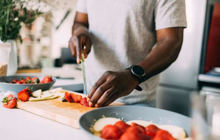 Resident working in kitchen at Greer Mill Residences in Greer, South Carolina