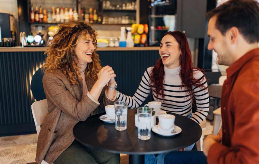 Resident friends having coffee at cafe near The Reserve at Kanapaha in Gainesville, Florida