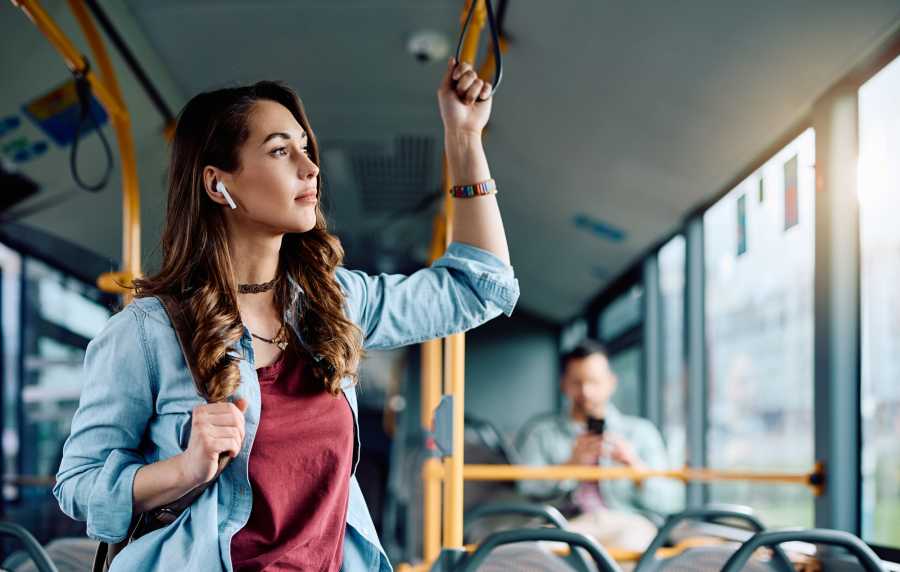 Woman traveling in the bus near Crystal Commons Townhomes in Gates, New York