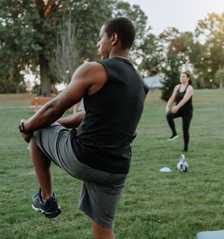 Residents stretching after a group workout in a park near The Residences at Lakehouse in Miami Lakes, Florida