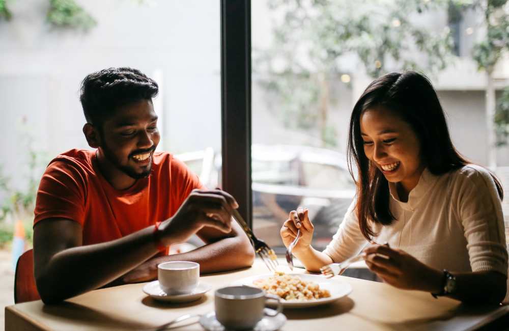 A couple having food at their favorite restaurant near The Bank Tower in Southgate, Michigan