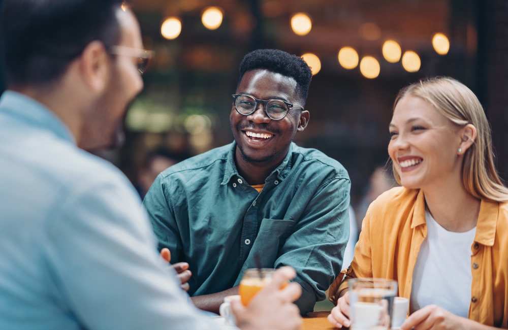 Friends enjoying drinks at a café near Icon Park in Sterling Heights, Michigan 