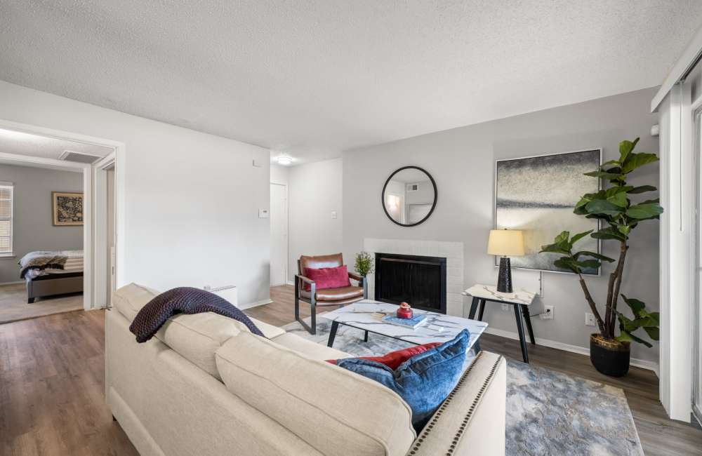Image showing the bright living room with a fireplace and bedroom entrance at 18Eleven Frankford in Carrollton,Texas
