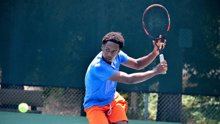 A man playing tennis | tennis courts in Midland
