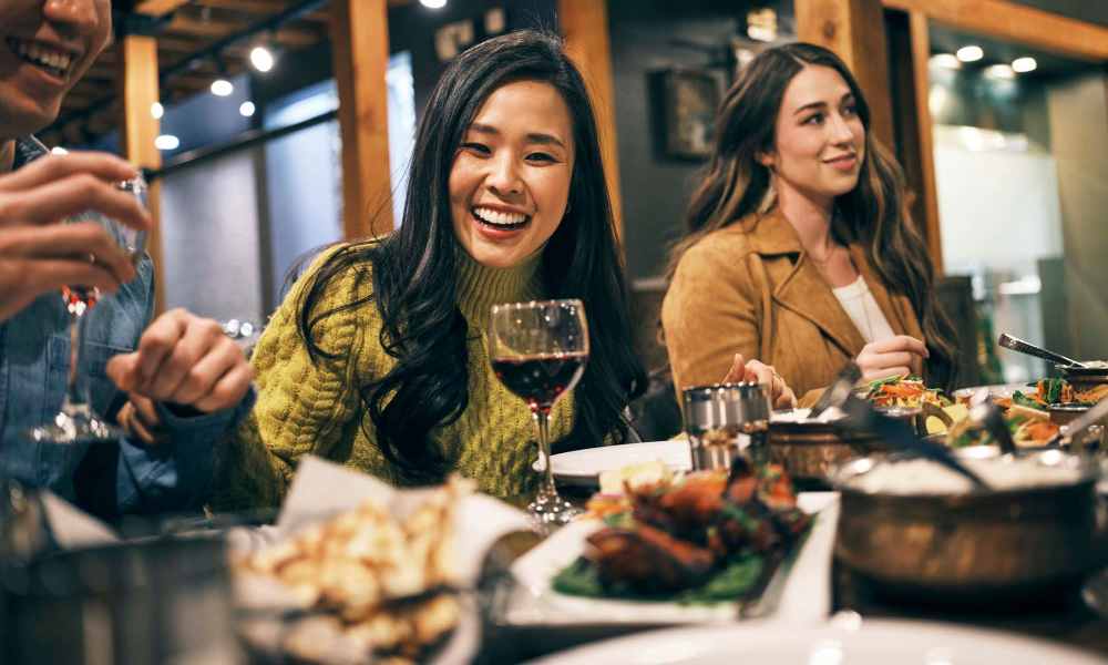 Resident enjoying drinks and fine dining near Champions Vue Apartments in Davenport, Florida 