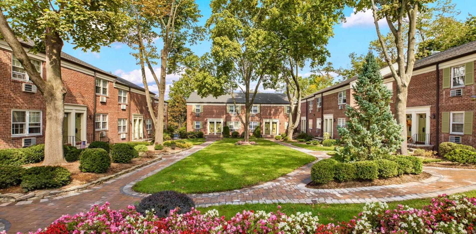 Beautiful brick exterior surround by a lush manicure landscape at General Wayne Townhomes and Ridgedale Gardens in Madison, New Jersey