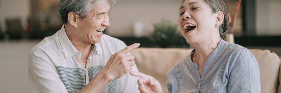 Residents engaging in conversation in a common area at Villas At Maple Ridge in Spooner, Wisconsin