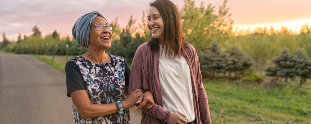 A resident walking with a staff member at Alder Bay Assisted Living in Eureka, California