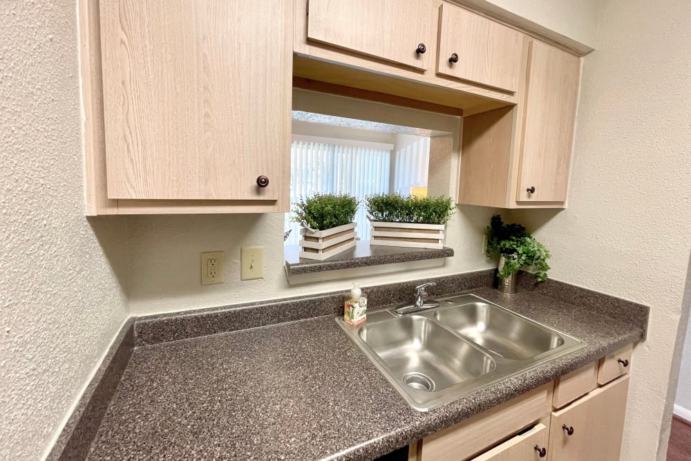 Kitchen sink in an apartment at The Abbey at Briar Forest in Houston, Texas