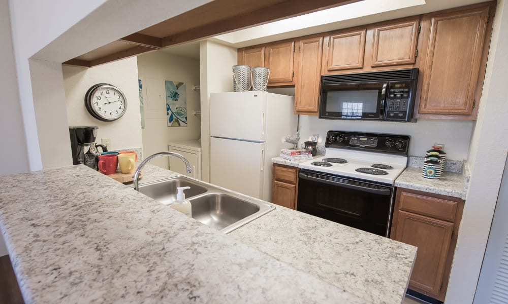 An apartment kitchen at The Courtyards in Tulsa, OK