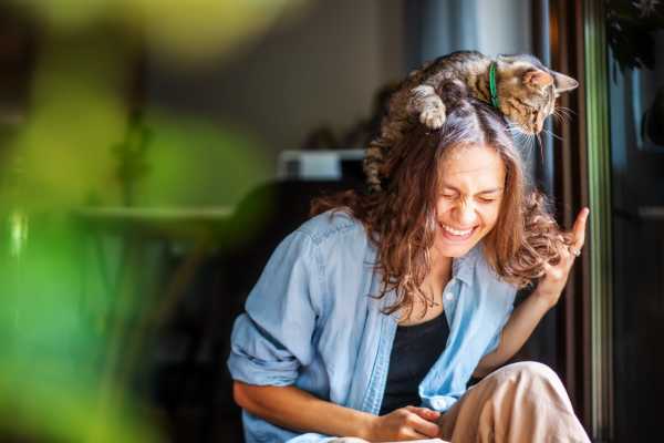 Resident playing with her cat at Home Suites Apartments in Sparks, Nevada
