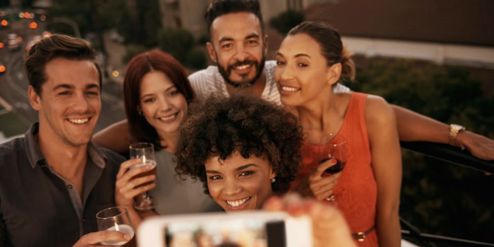 A group of friends talking a selfie near Vesta Creeks Run in North Charleston, South Carolina