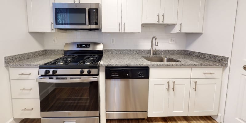 Model kitchen with stainless-steel appliances at Hallfield Apartments in Nottingham, Maryland