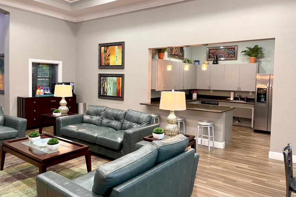 Resident lounge and community kitchen at The Abbey at Grant Road in Houston, Texas