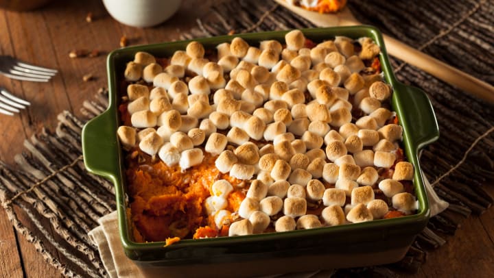 Sweet potato casserole with a layer of pecans and toasted marshmallows