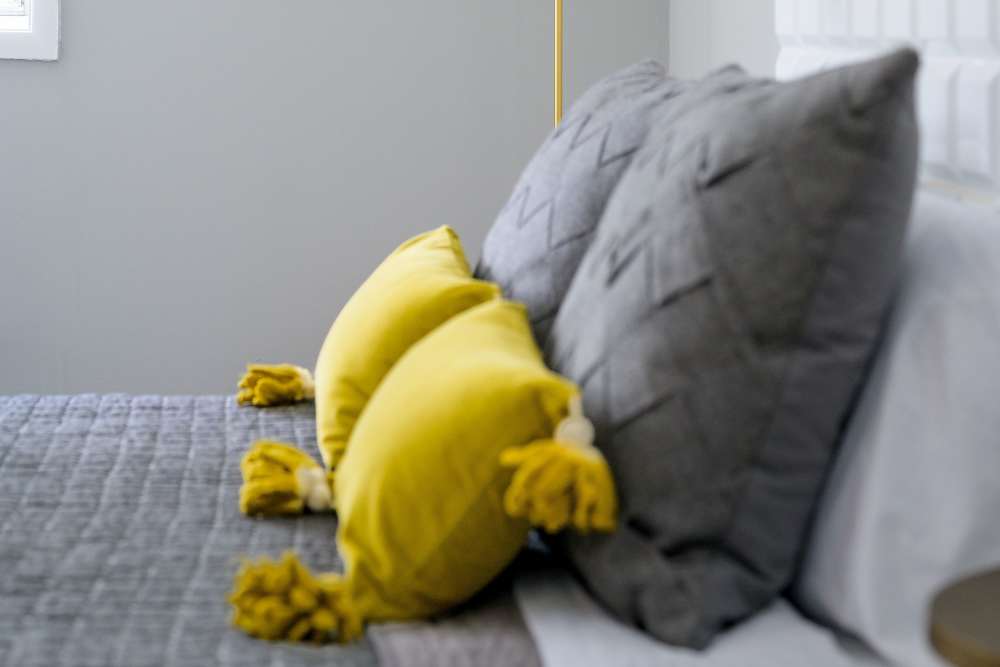 Spacious bedroom with pillows on the bed at Beacon Hill Apartments in Alexandria, Virginia