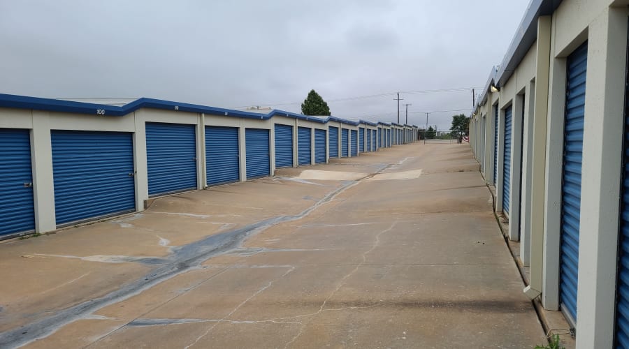 Exterior view of storage units with blue doors at KO Storage of Wichita Falls - North in Wichita Falls, Texas