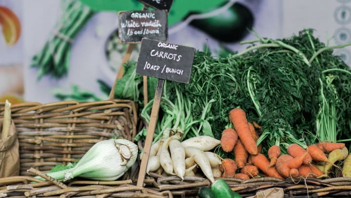 Fresh produce on display at a farmers market near The Davis in Fort Worth, Texas