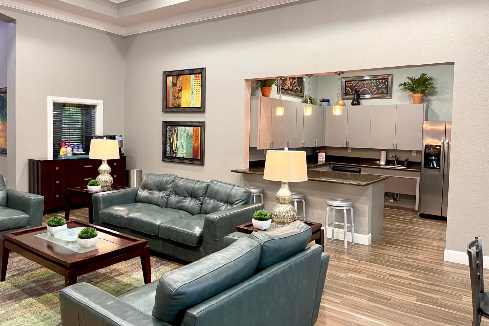 Resident lounge and community kitchen at The Abbey at Grant Road in Houston, Texas