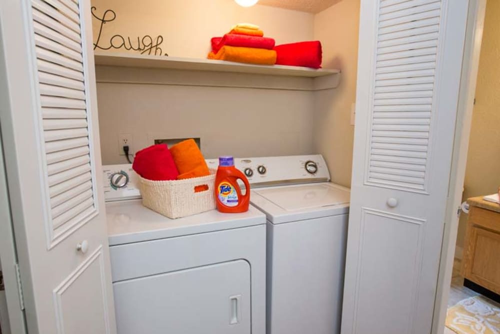 In home washer and dryer with storage space above at Berkshire 54 in Carrboro, North Carolina