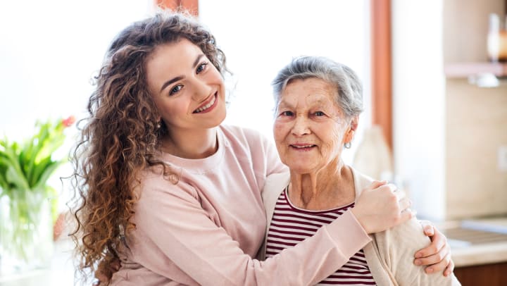 Elderly woman and adult woman smiling