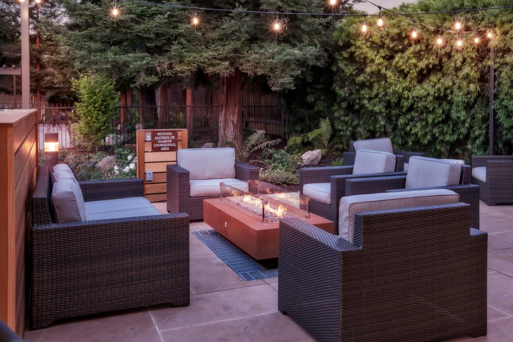 Outdoor lounge with a firepit at Brookdale Apartments in San Jose, California