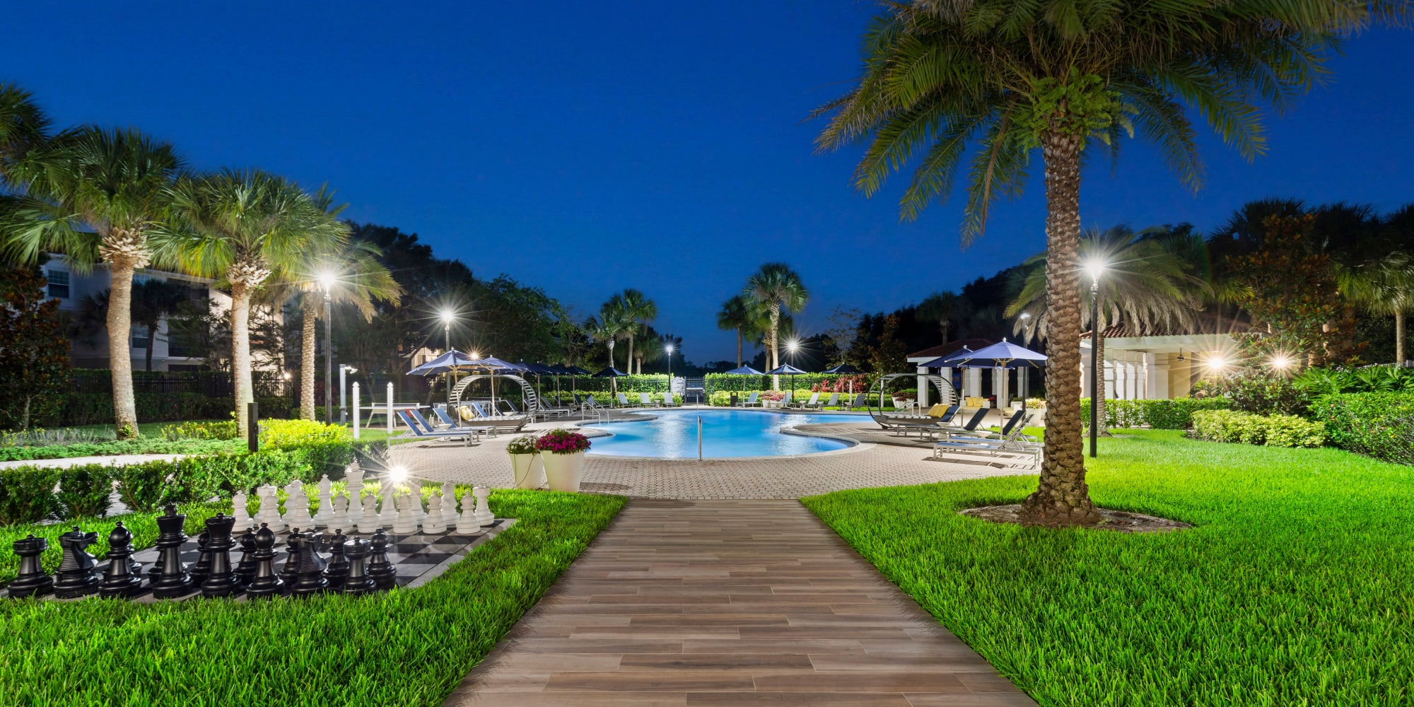 Swimming pool at night at Harbortown Apartments in Orlando, Florida