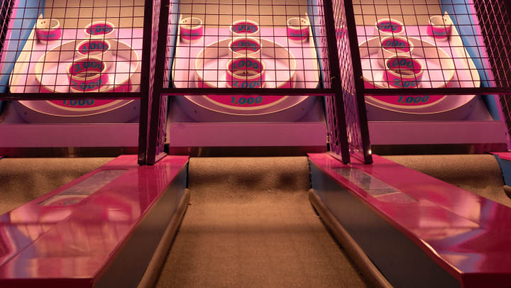 three skee-ball machines side by side | arcades in Chandler
