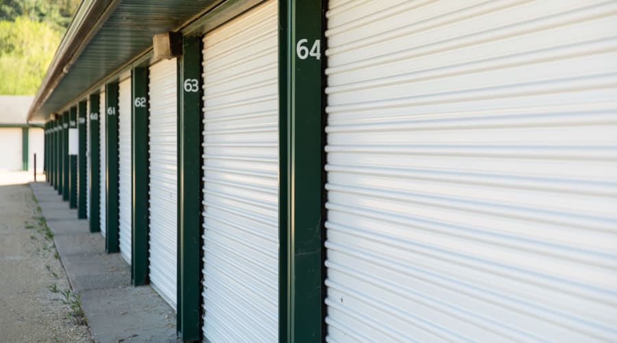 Storage units with white doors and locks at KO Storage in Knapp, Wisconsin