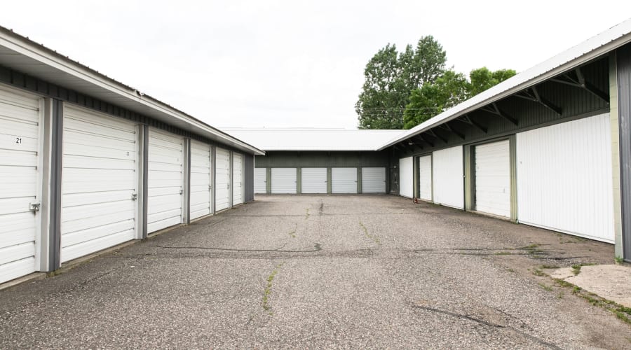 Storage units with white doors and locks at KO Storage of Maple Lake - Lumber in Maple Lake, Minnesota