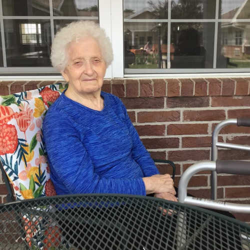 Resident with caregivers decked out in Valentines day props at Madison House in Norfolk, Nebraska