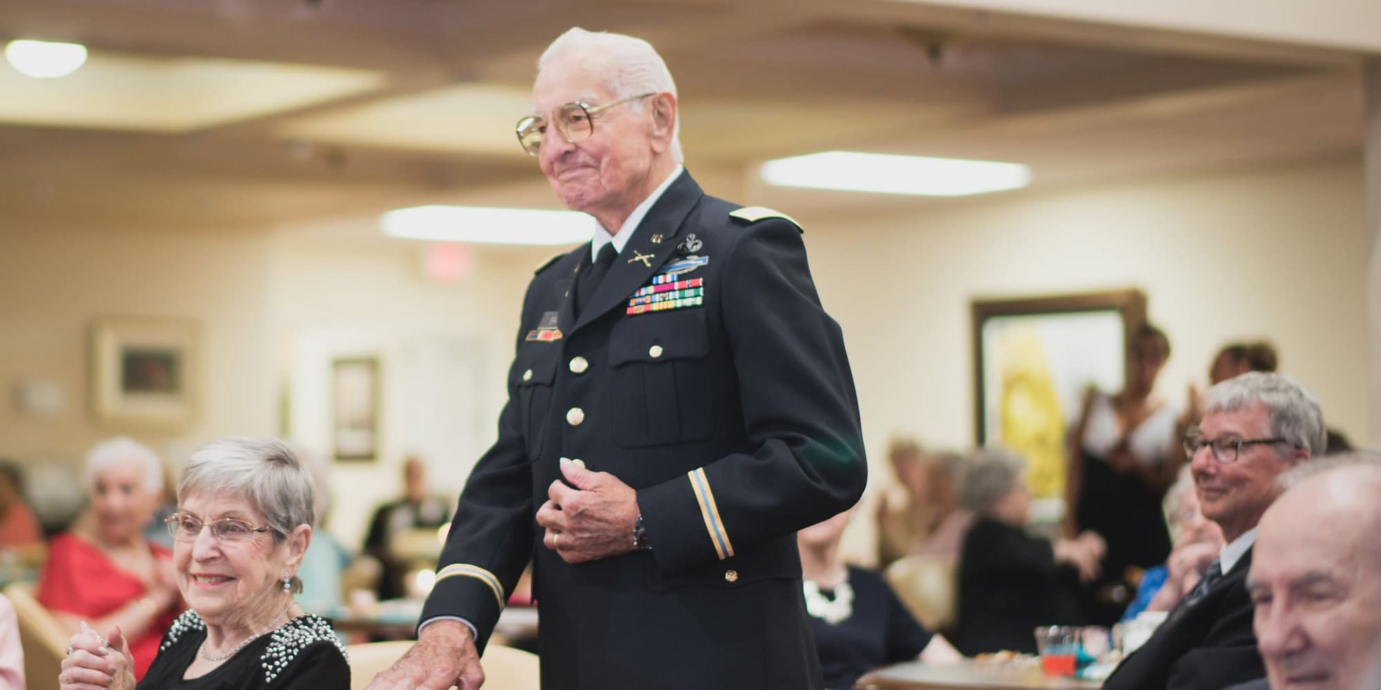 A veteran being recognized at Ashwood Meadows Gracious Retirement Living in Johns Creek, Georgia