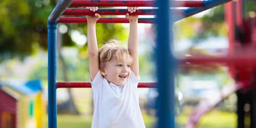 Kid playing in the playground at Rancho Niguel Apartments in Laguna Hills, California